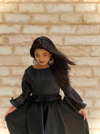 Mysteriously Elegant Black Satin Gown with Bell Sleeves